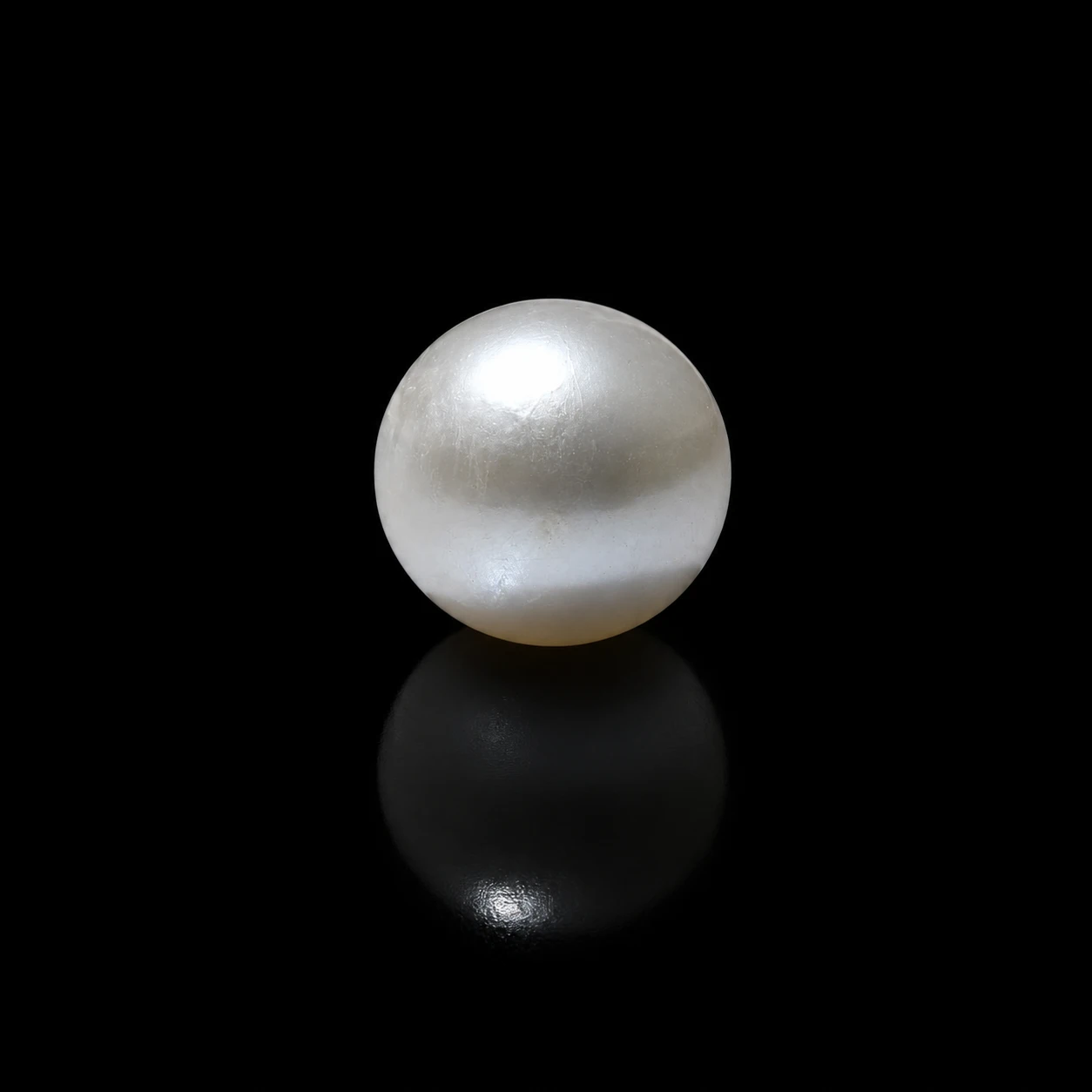10.25 ct Certified Hyderabadi Pearl stone black background