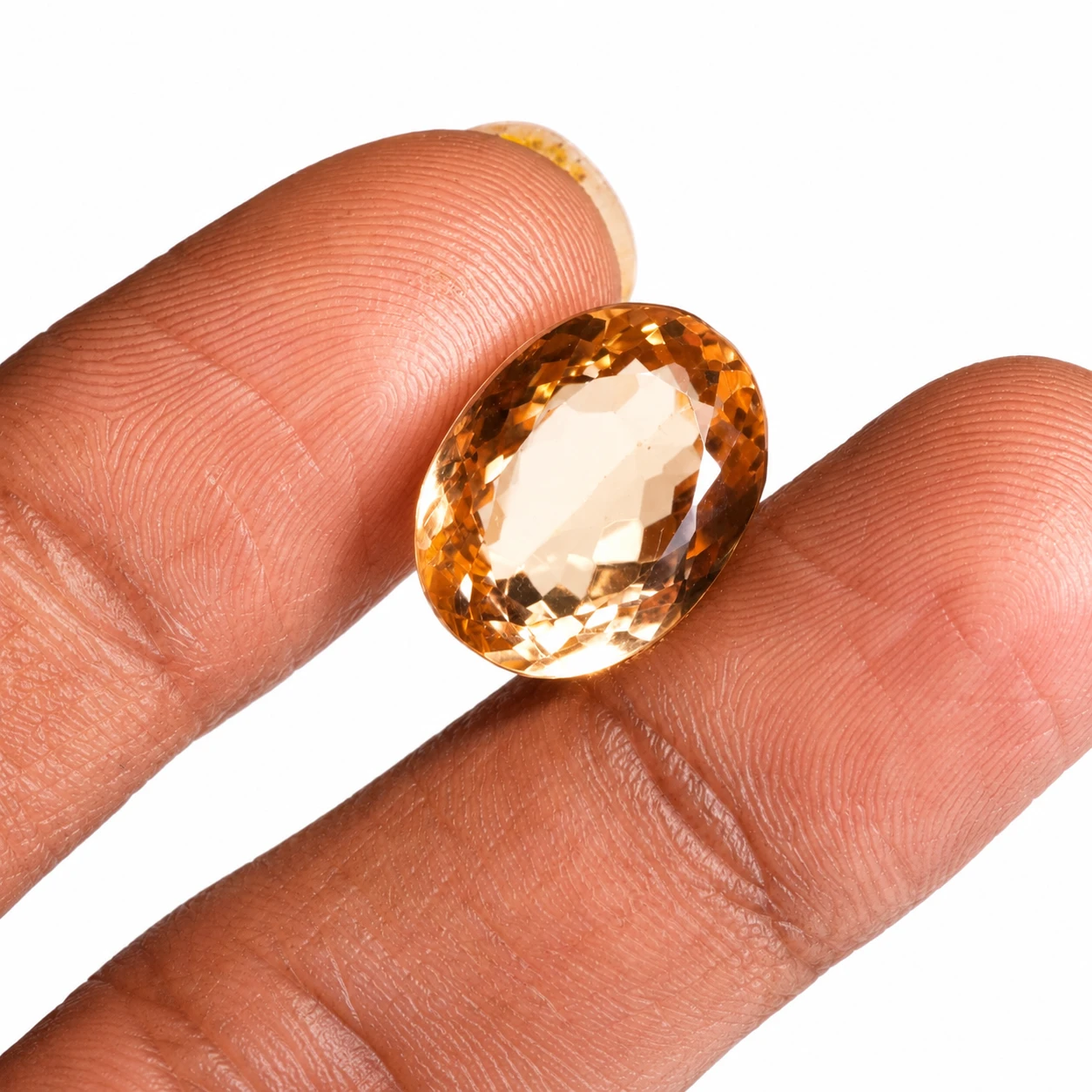 12.54 ct Yellow Topaz Gemstone with finger