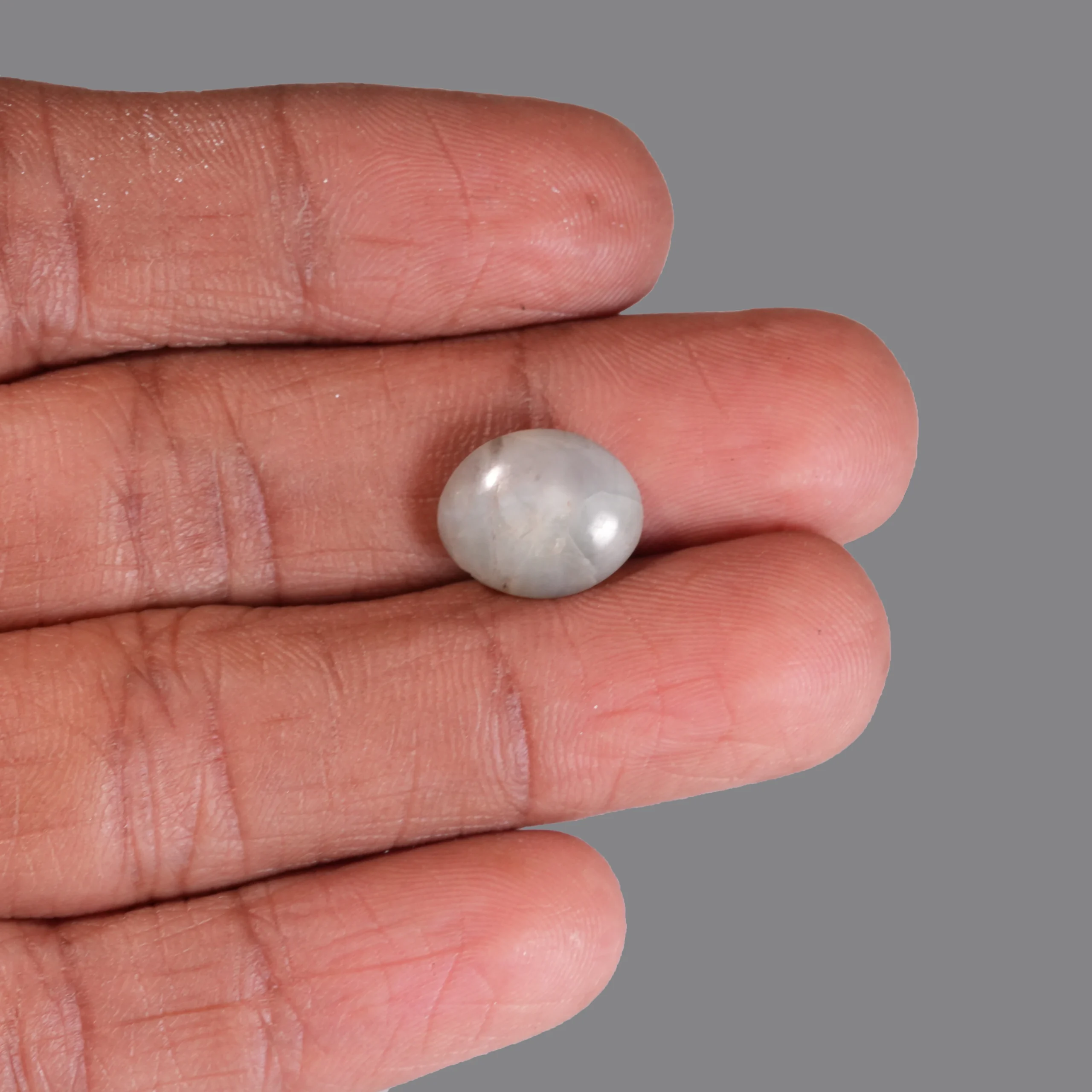 5.85 ct Natural Cat Eye gemstone with finger