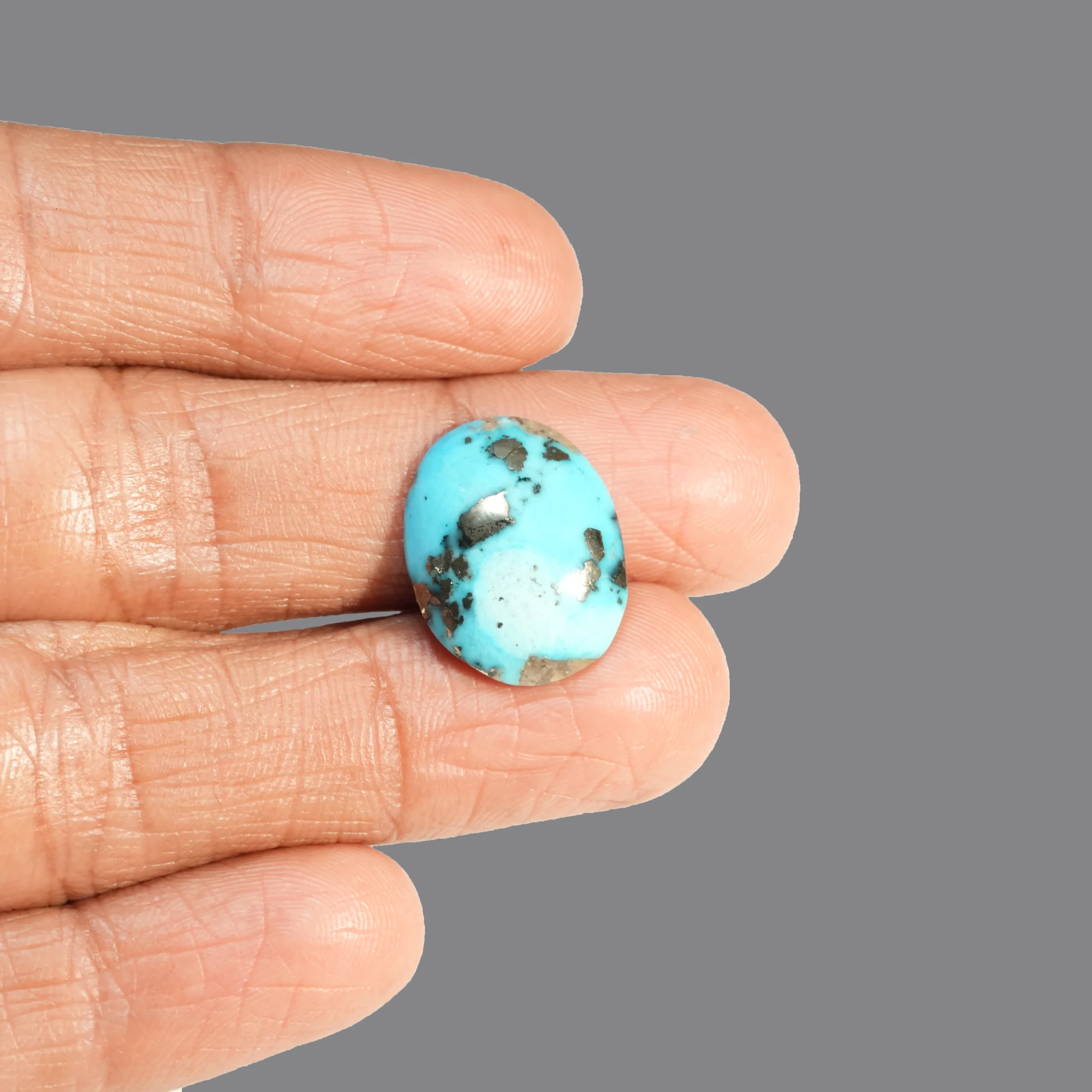 Turquoise Gemstone with finger